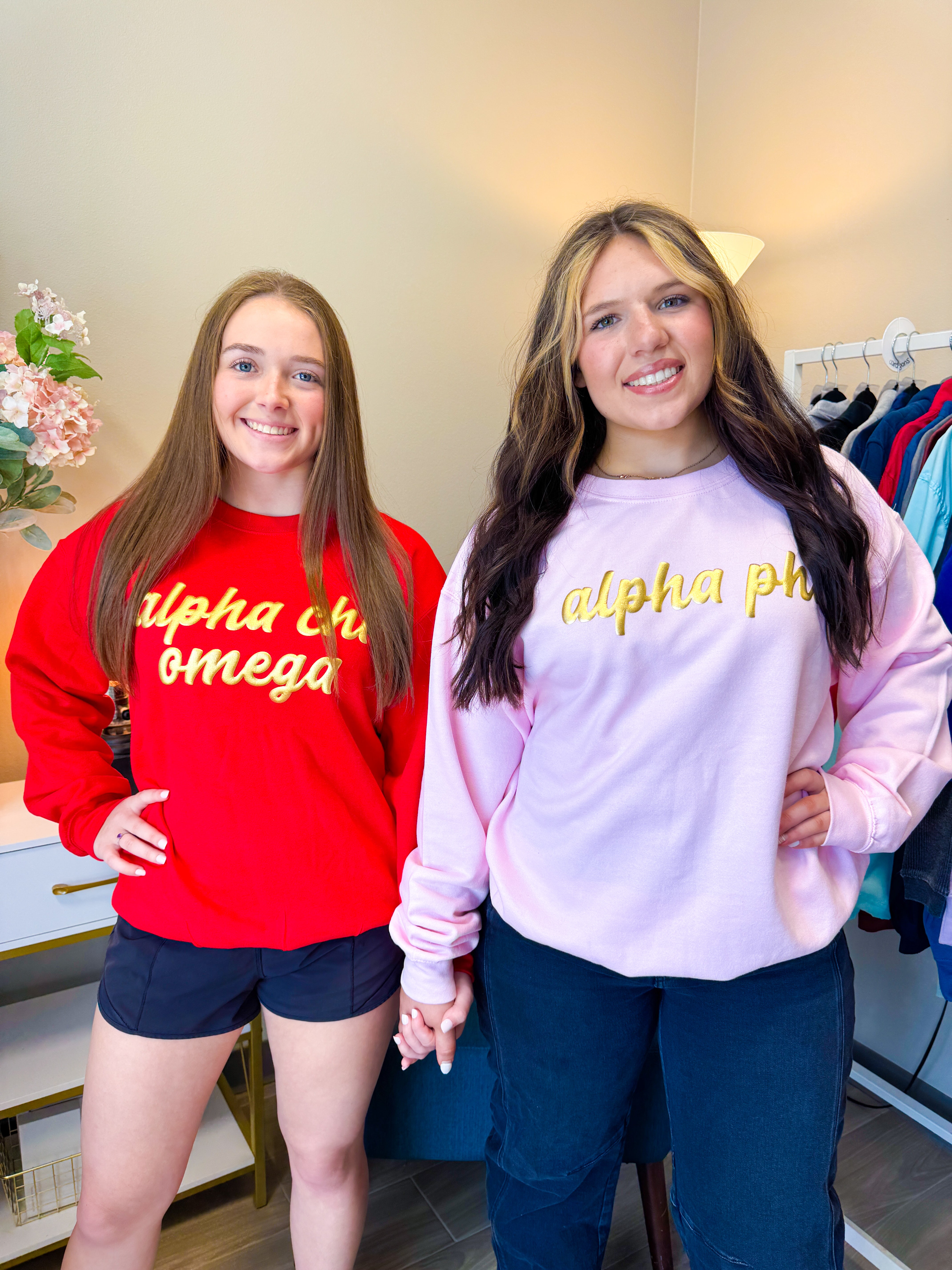 Alpha Chi Omega and Alpha Phi gold puff sweatshirts